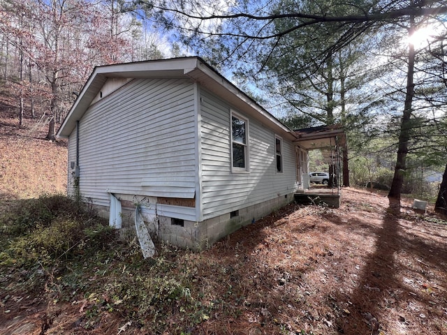 view of side of property featuring crawl space