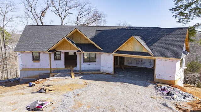 554 Colson Dr, Bronston, KY 42518 - property in mid-construction featuring roof with shingles and gravel driveway