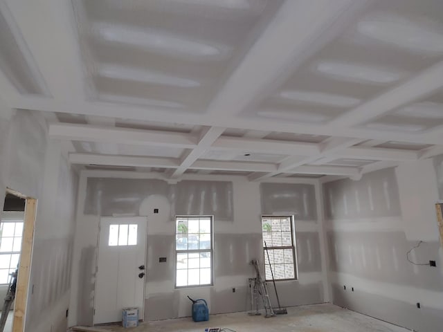 interior space with coffered ceiling and beam ceiling