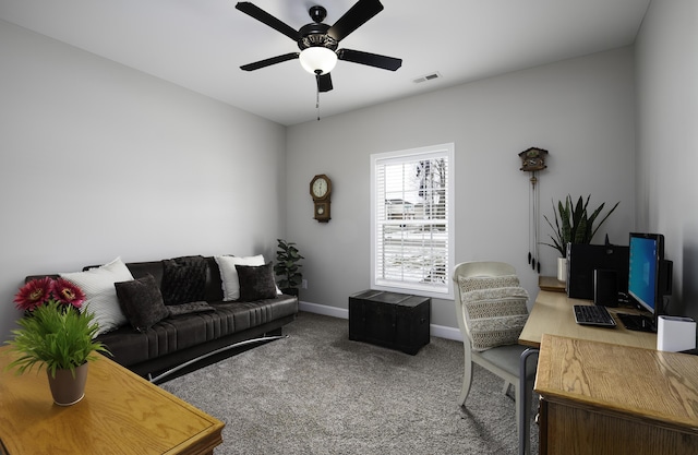 interior space with a ceiling fan, baseboards, visible vents, and carpet flooring