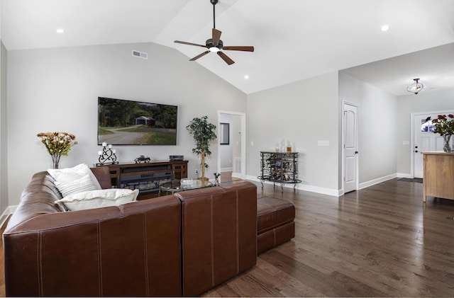 living area with dark wood-style flooring, a ceiling fan, visible vents, vaulted ceiling, and baseboards