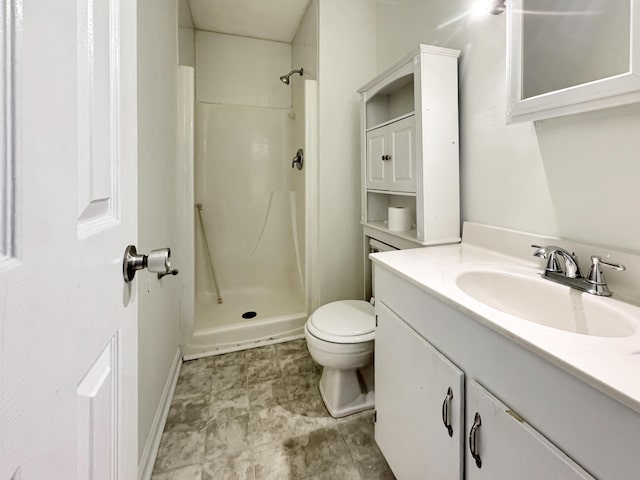 full bathroom with toilet, a stall shower, and vanity