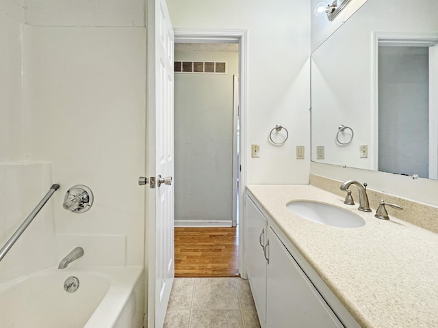 full bath with bathtub / shower combination, visible vents, vanity, and tile patterned floors