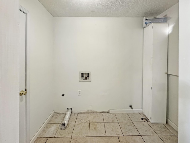 washroom with a textured ceiling, light tile patterned flooring, hookup for a washing machine, laundry area, and electric dryer hookup