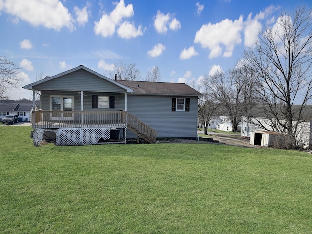 back of property featuring a yard and stairs