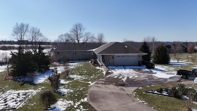 view of front of property featuring an attached garage and driveway