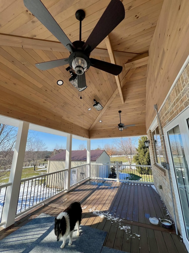 wooden deck with a ceiling fan