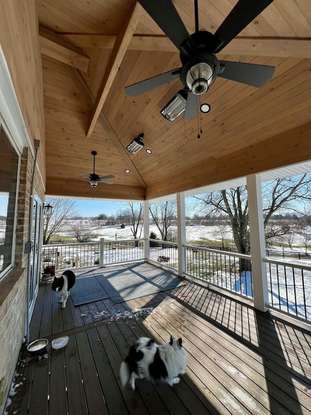 snow covered deck with a ceiling fan