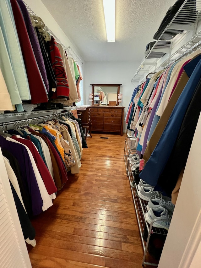 spacious closet with wood finished floors