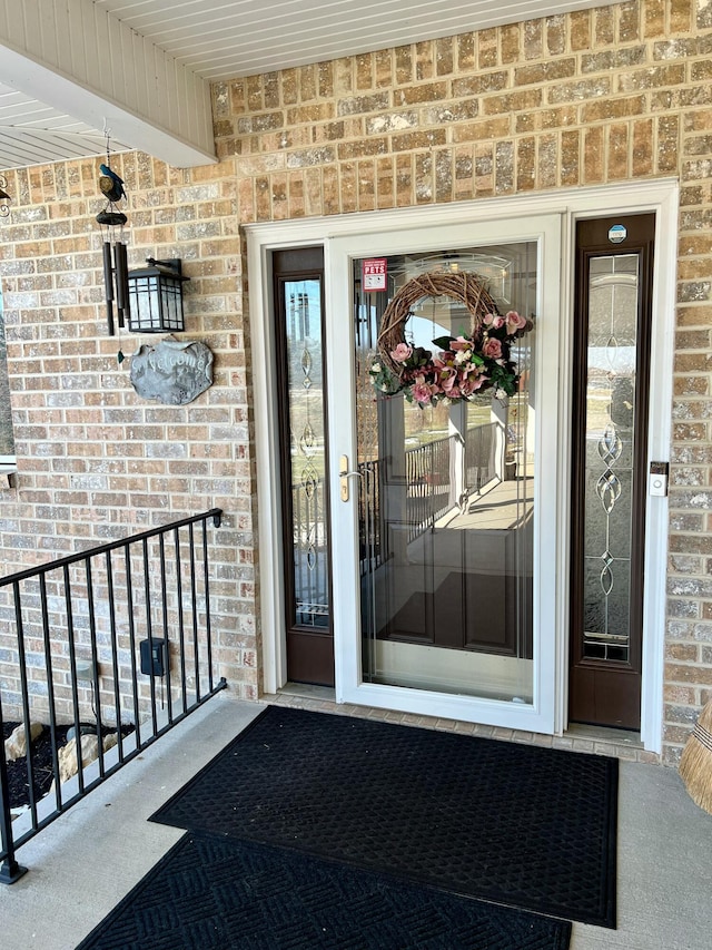 entrance to property with brick siding