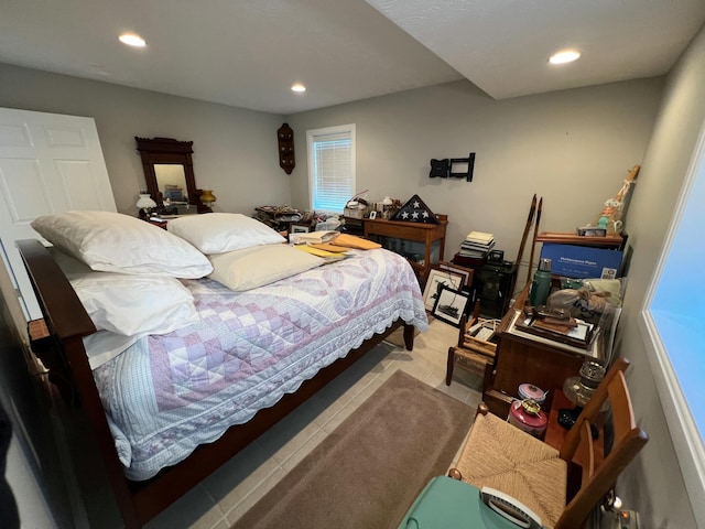 bedroom featuring light tile patterned floors and recessed lighting