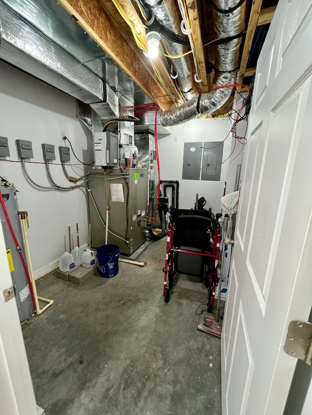 unfinished below grade area featuring electric panel and water heater