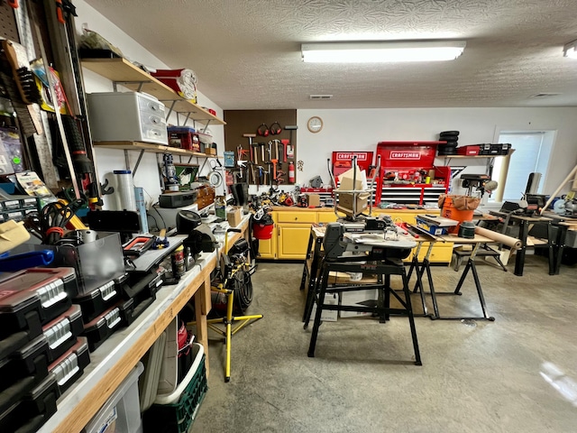 interior space featuring a workshop area