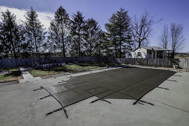 view of pool featuring fence private yard, a patio area, and a fenced in pool