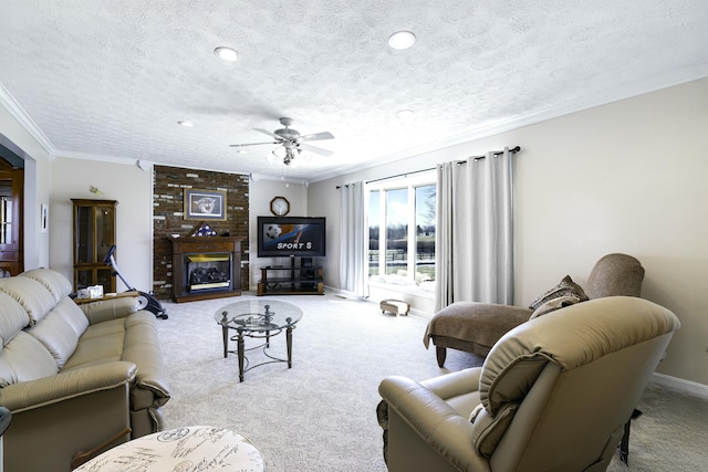 living room featuring a textured ceiling, light colored carpet, baseboards, ornamental molding, and a brick fireplace