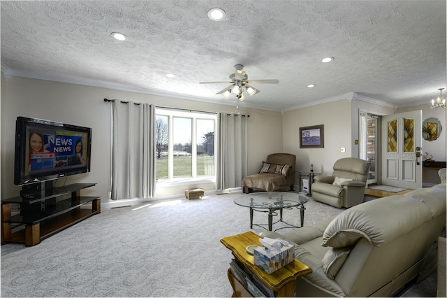 living area with carpet, ornamental molding, and a textured ceiling