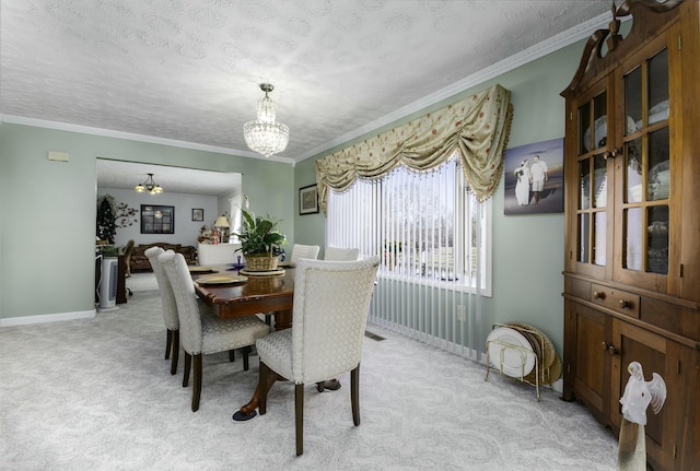 dining area with light carpet, a textured ceiling, baseboards, and an inviting chandelier