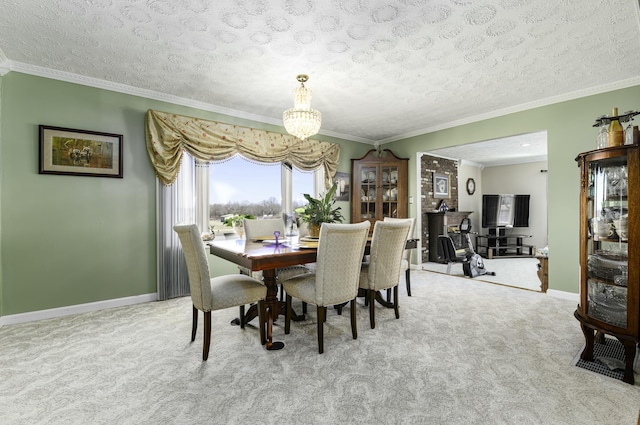 dining room with ornamental molding, light colored carpet, and baseboards