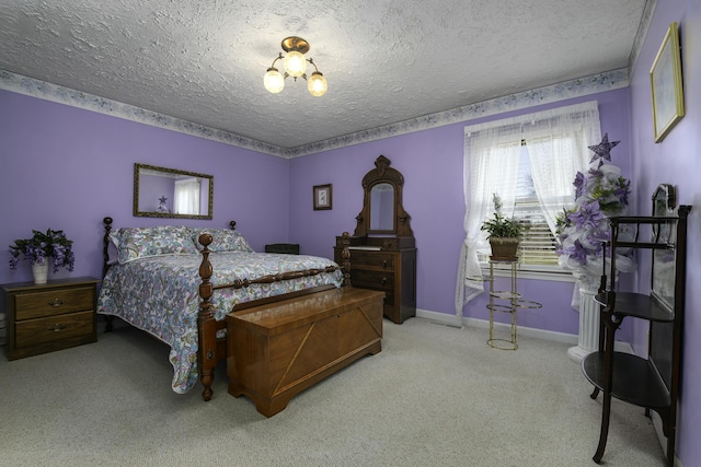 bedroom featuring light carpet, a textured ceiling, and baseboards