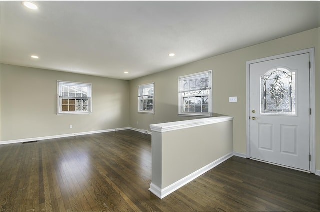 entryway featuring dark wood-style floors, baseboards, and recessed lighting