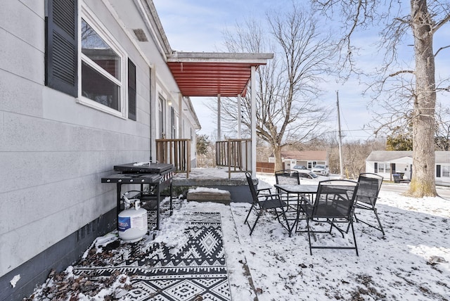 view of snow covered patio