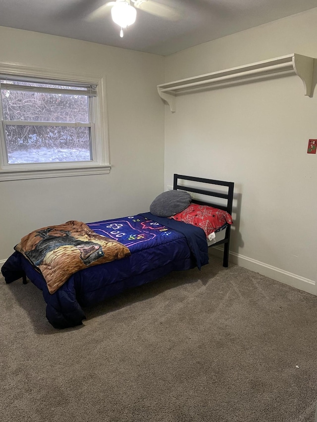 bedroom featuring a ceiling fan, carpet flooring, and baseboards