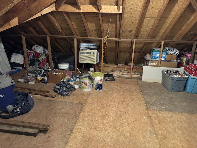 attic featuring a wall mounted AC