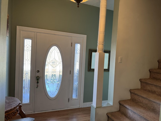 entryway featuring wood finished floors and stairs