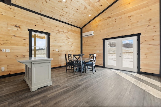 dining space featuring dark wood-style floors, wooden walls, a wall mounted air conditioner, and french doors