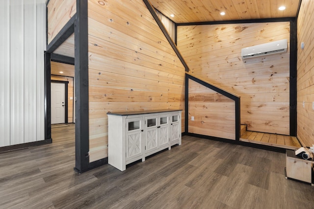 additional living space featuring dark wood finished floors, wood ceiling, a wall mounted air conditioner, wood walls, and recessed lighting