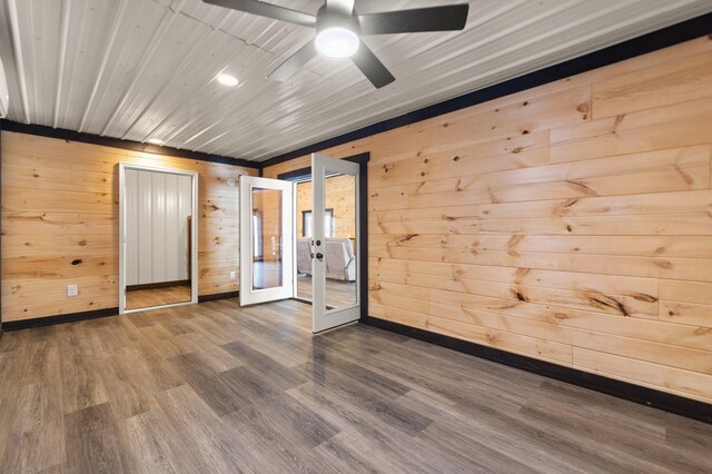 spacious closet with dark wood finished floors