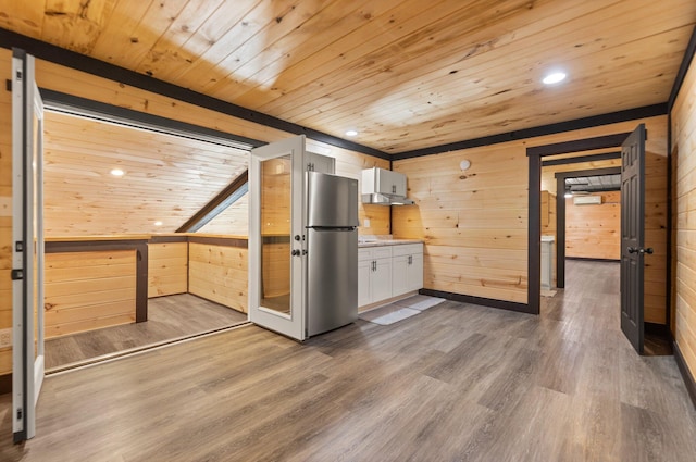 kitchen with wood ceiling, light countertops, wood finished floors, and white cabinetry