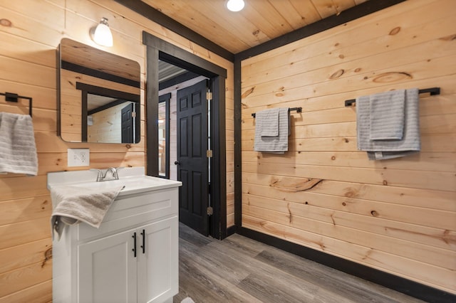 hallway with wood ceiling, wood walls, and wood finished floors