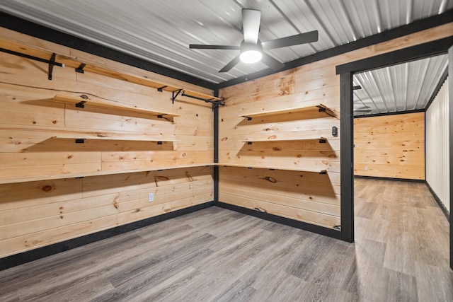 spare room with ceiling fan and wood finished floors