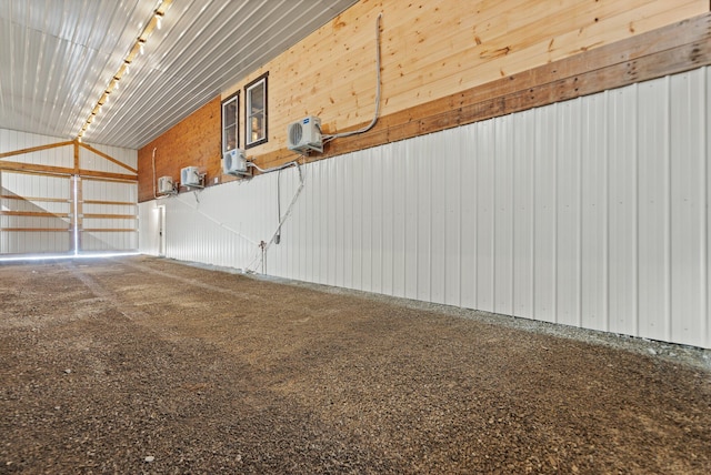 garage with a wall unit AC and metal wall