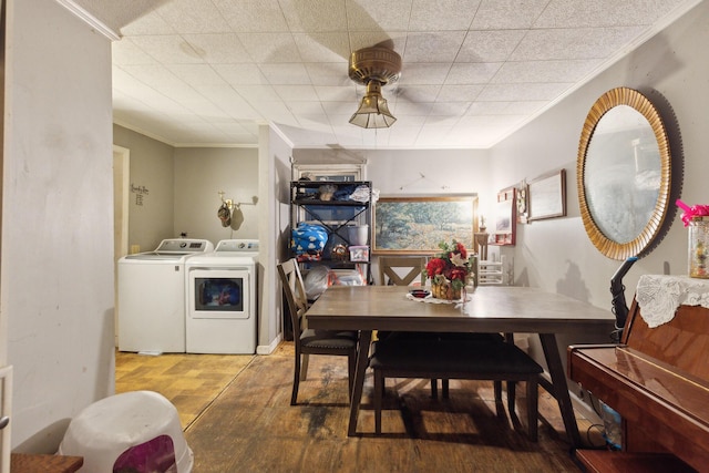 dining room with ornamental molding and washer and clothes dryer