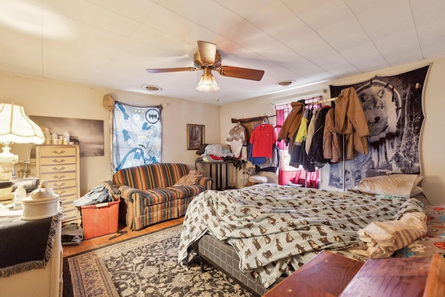 bedroom with visible vents and a ceiling fan