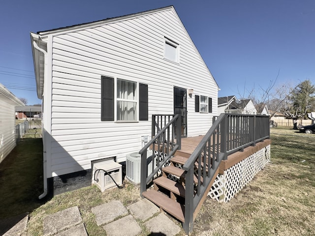 back of house with cooling unit, fence, and a deck