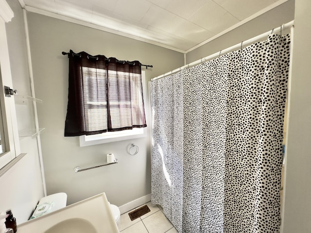 bathroom with visible vents, baseboards, a shower with shower curtain, tile patterned flooring, and a sink