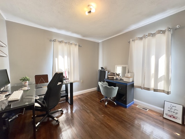 office area with baseboards, visible vents, ornamental molding, dark wood-style flooring, and a textured ceiling