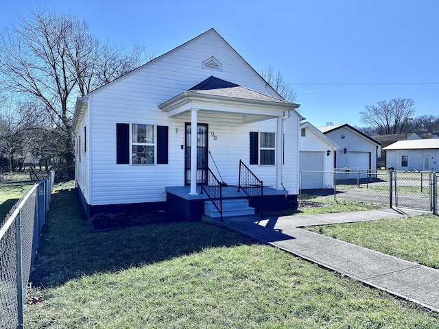 view of front of house featuring a front yard, fence, and a gate