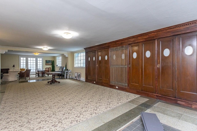 interior space with a healthy amount of sunlight and crown molding