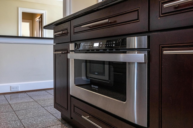 interior details featuring oven and baseboards