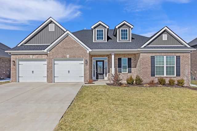 craftsman-style home featuring driveway, an attached garage, a front lawn, and brick siding