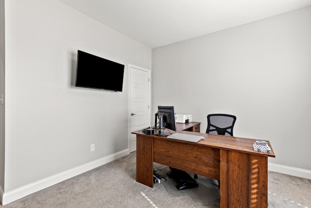 office featuring light carpet and baseboards