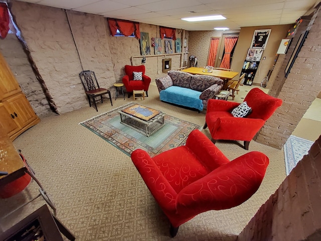 living area with a paneled ceiling