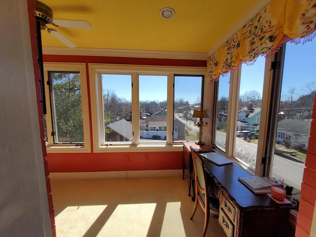 sunroom / solarium featuring a residential view