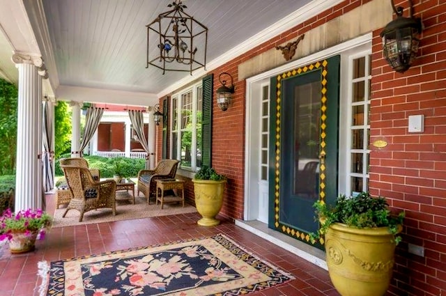 doorway to property with brick siding