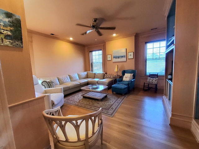 living room with crown molding, recessed lighting, visible vents, a ceiling fan, and wood finished floors