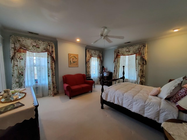 bedroom featuring carpet floors, recessed lighting, visible vents, ornamental molding, and a ceiling fan